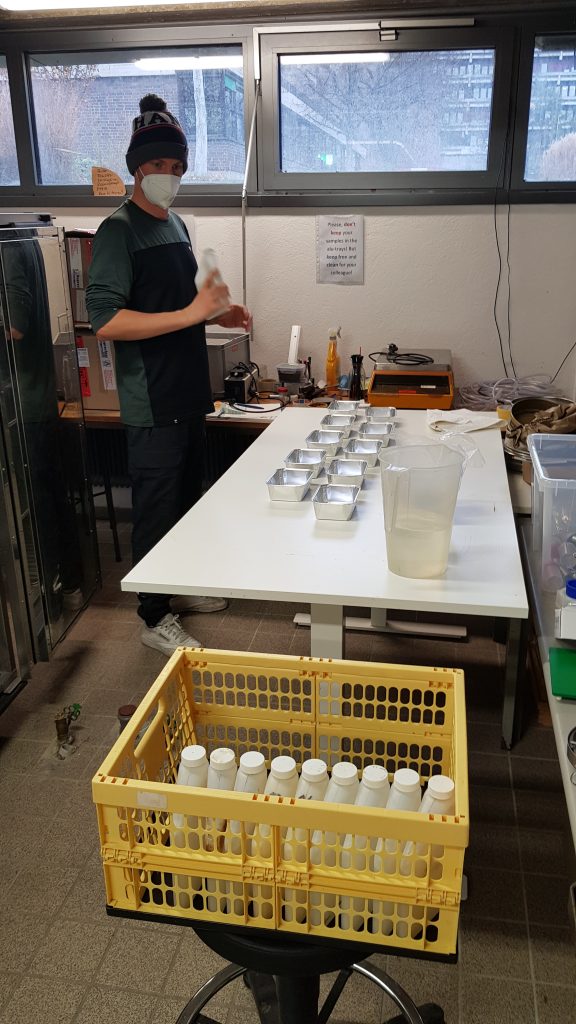 Clemens filling the water samples from the bottles into the boxes
